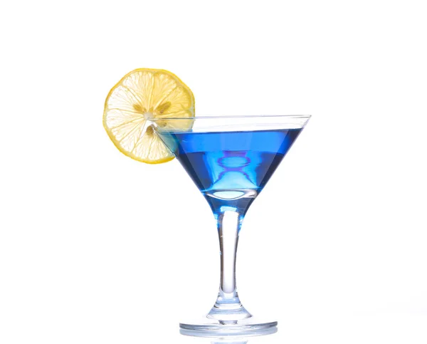 stock image Blue lagoon cocktail in martini glass with lemon slice isolated on white background