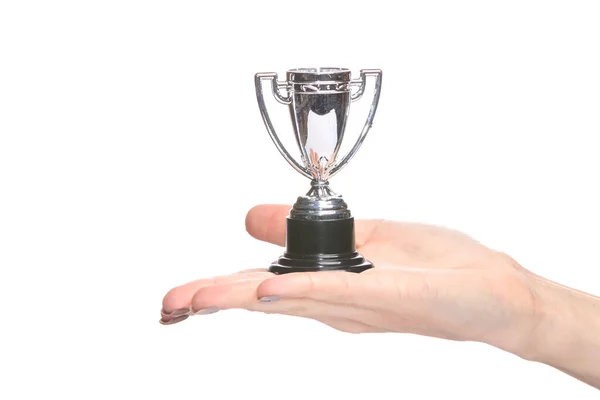 stock image Winner cup on palm of hand isolated on white background