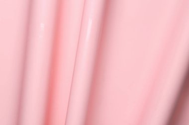 Pastel pembe renkli plastiğin dalgalı dokusu