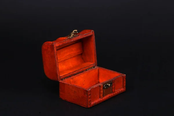 Red Pirate chest isolated on black background