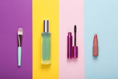 Women's cosmetic accessories on colored background. Top view. Creative layout