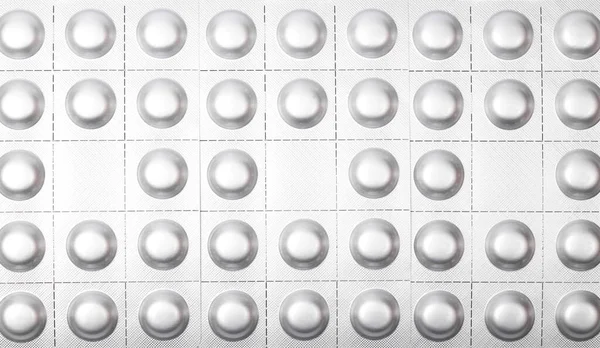 Metal blisters of pills background