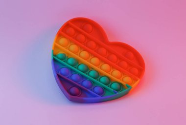 popular pop it antistress toy heart shaped in neon light
