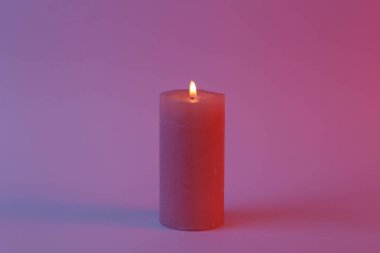 Flaming aroma candle in neon light