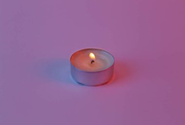 Flaming aroma candle in neon light
