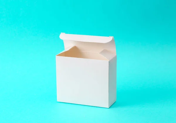 Mockup of white empty box on turquoise background