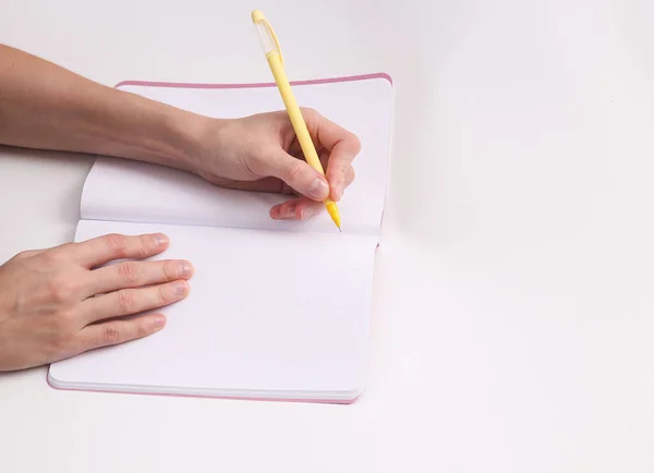 Female Left Hand Writes Empty Notebook Gray Background Lefty Royalty Free Stock Photos