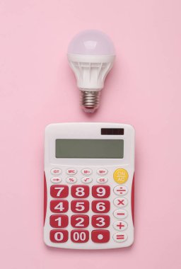 Creative idea. Business concept. Calculator with light bulb on pink background