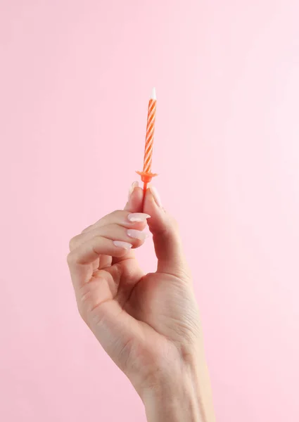 Woman Hand Holding Birthday Candle Pink Background — Stock Photo, Image