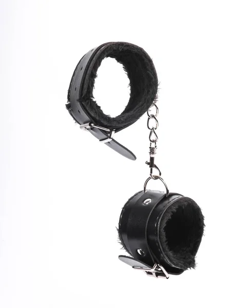 Beyaz arka planda seks oyunları için deri bdsm kelepçeler