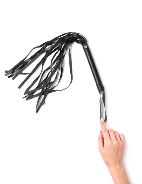 女性手ホールドA革鞭からセックスショップ上の白の背景 — ストック写真