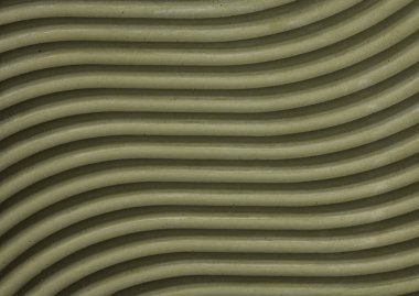 Yeşil alçı figürünün dalgalı yüzeyi