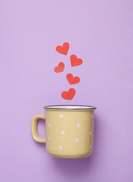 Ceramic cup with hearts on a pastel background on a pastel background. Love concept