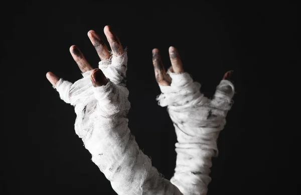 stock image Mummy hands wrapped in a bandage isolated on a black background. Halloween concept