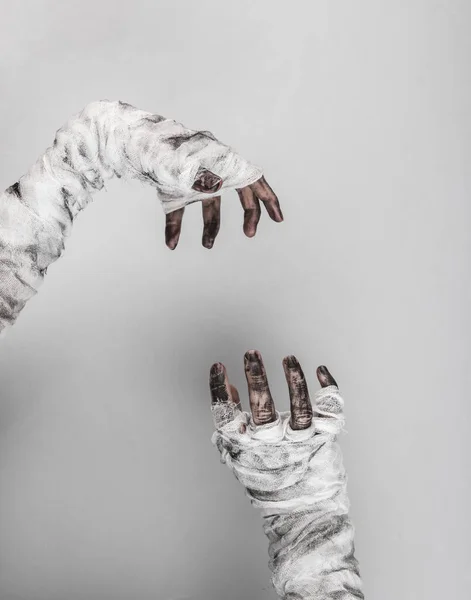 stock image Mummy hands wrapped in a bandage isolated on a black background. Halloween concept