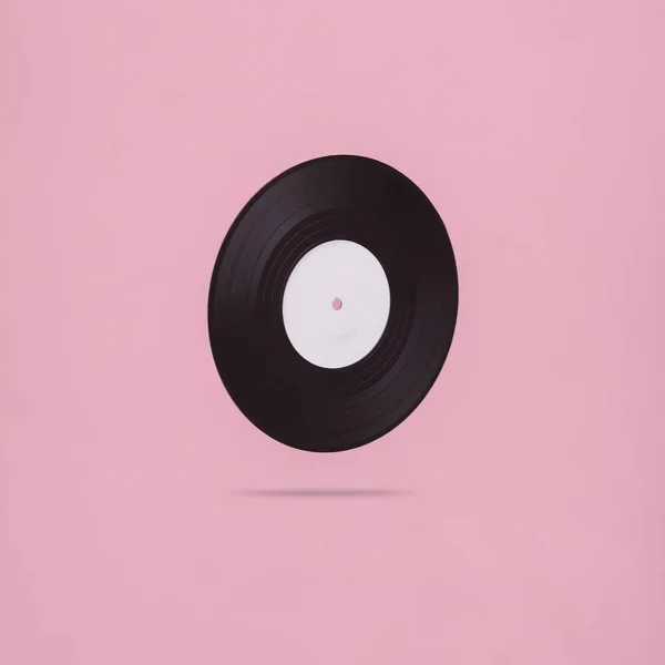 Ρετρό Βινύλιο Ρεκόρ Αιωρείται Ένα Ροζ Φόντο Minimalism Μουσική Έννοια — Φωτογραφία Αρχείου