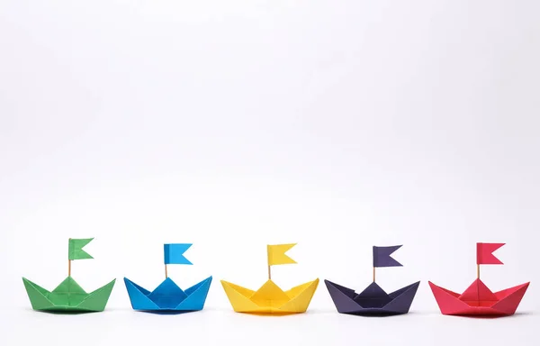 stock image Many colored boats with flags on white background. Business, leadership concept