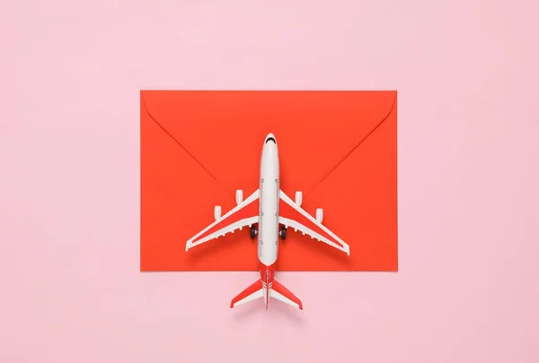 Toy Plane Model Red Envelope Pink Background Travel Concept Top — Stock Photo, Image
