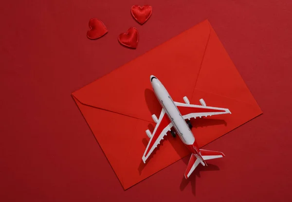 Toy Air Plane Model Red Envelope Hearts Red Background Travel — Stock Photo, Image