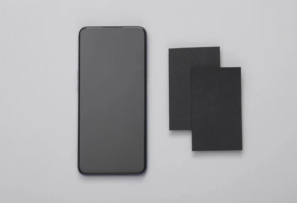 Smartphone Black Business Cards Branding Gray Background — Stock Photo, Image