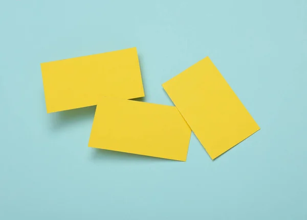 stock image Yelow Blank business cards for corporate identity on blue background. Creative mockup.