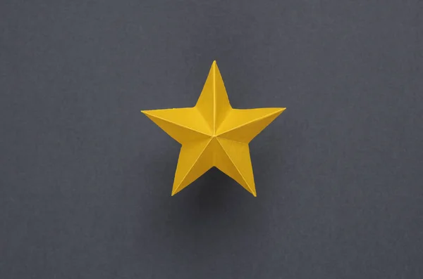 One paper star on gray background. Service rating