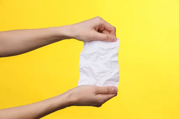 Female Hands Holding Empty Crumpled White Sheet Paper Yellow Background — Stock Photo, Image