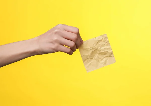 Woman Hand Holds Yellow Crumpled Memo Piece Paper Yellow Background — Stock Photo, Image
