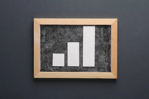 Bar chart with chalk board on gray background