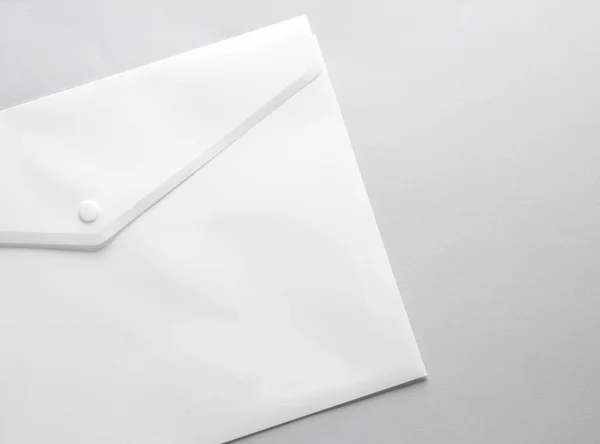 White Plastic Envelope Folder Gray Background — Stock Photo, Image