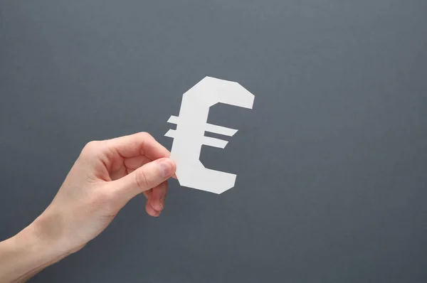 Hand Hält Euro Symbol Papierform Auf Grauem Hintergrund — Stockfoto