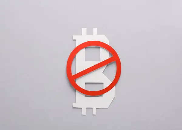 Bitcoin currency symbol with prohibition sign on gray background
