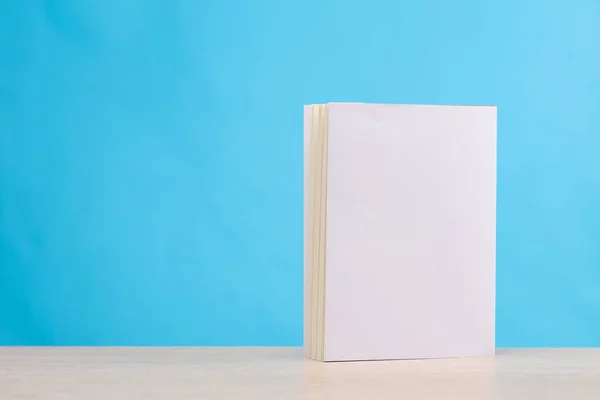 Book with white cover on blue background