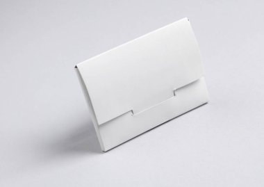 White box for new bank card on a gray background clipart