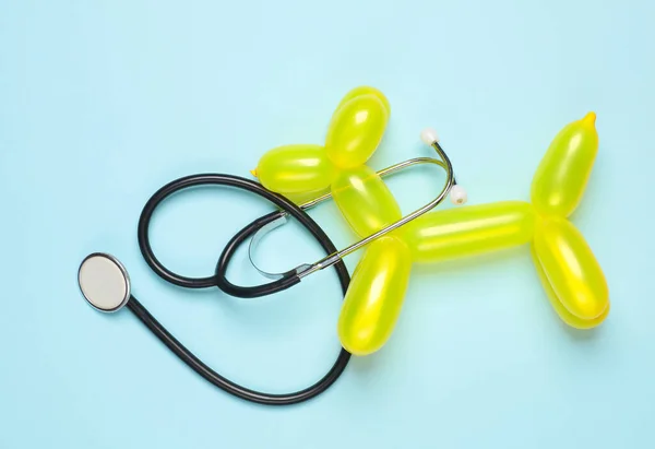 Veterinary medicine. Balloon dog with stethoscope on blue background