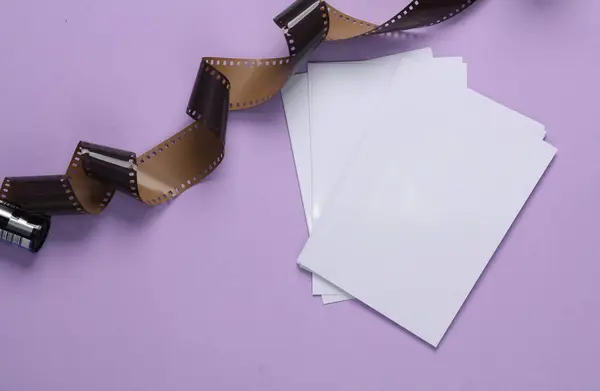 Blank photo mockup and camera roll on magenta background