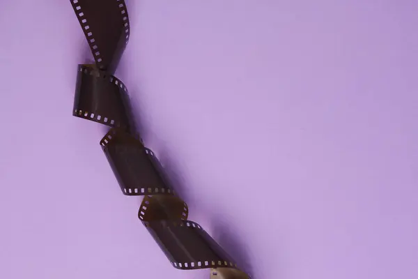 Photographic film on lavender background