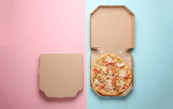 Open and closed pizza boxes on a pink blue background. Template for design. Top view