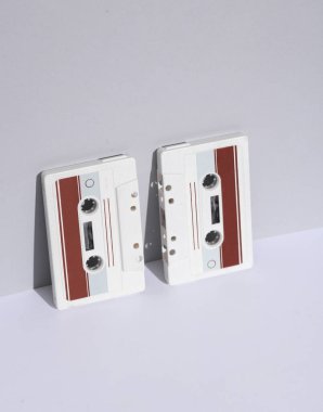 Retro 80s audio cassettes on white background with shadow. Creative layout, minimalism, music lover clipart