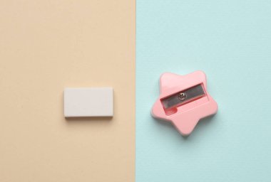 Renkli pastel arka planda silgi ve bileyici