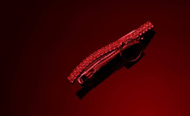 Kırmızı ışıklı değerli taşlı saç tokası.