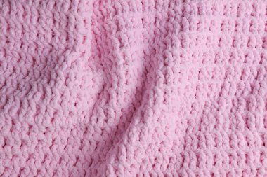 Pembe örülmüş ekose kumaşın dokusu.