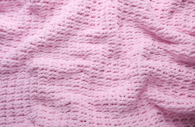Pembe örülmüş ekose kumaşın dokusu.