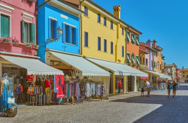 Caorle, Italy - September 3, 2020: The typical  colorful houses and shops of the old town clipart