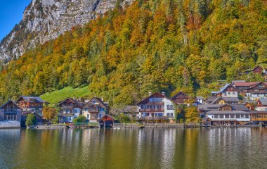 Hallstatt, Austria, view of the village vith the traditional houses and the wooden boat sheds on the Hallstatter see or Hallstatt lake clipart