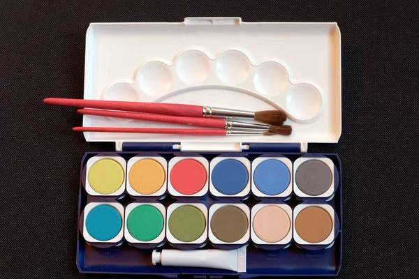 stock image Hobby,Drawing and painting: painting box with watercolors and brushes