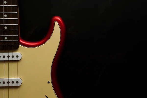 Electric guitar body isolated on black background. Entertainment and music concept.