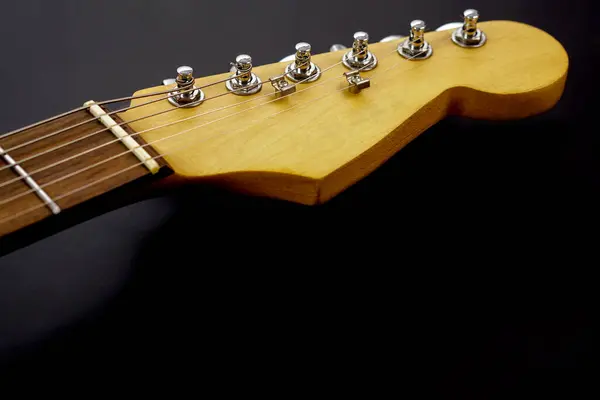 stock image Selective focus, electric guitar neck on black background with copy space. Love, entertainment and music concept.