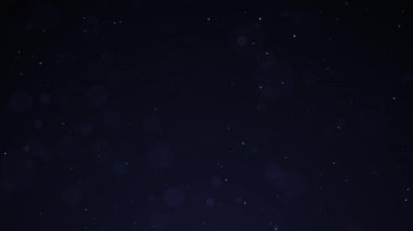 Siyah Arkaplan 'daki Mavi Parçacıklar. Yıldızlı Parıldayan Parçacıklar. Bokeh parçacıkları yavaşça uçuyor