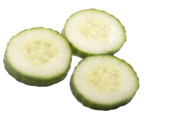 Homemade chopped cucumber.Fresh organic cucumber isolated on white background. File contains clipping path. Full depth of field.,